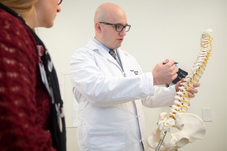 MENGER PRESENTS SPINAL DEFORMITY PROGRAM TO USF GRAND ROUNDS