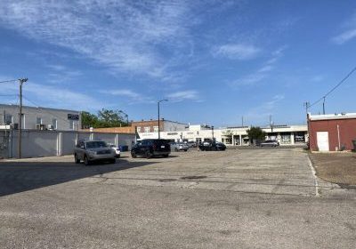 FOLEY TO BUY PARKING LOT AT HIGHWAYS 59 AND 98