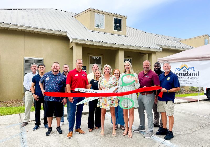 HOMELAND NEIGHBORHOOD MANAGEMENT CUTS RIBBON IN FOLEY