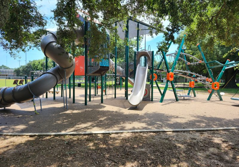 MOBILE CUTS RIBBON ON FIGURES PARK PLAYGROUND