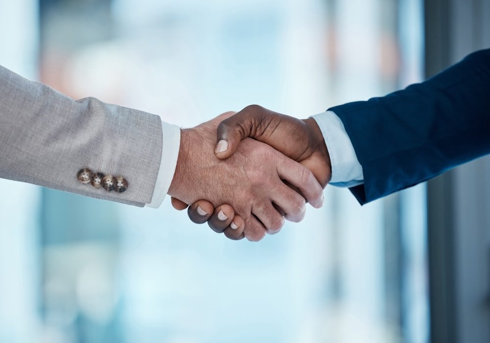 Thank you, welcome and business people in office with handshake for recruitment, deal and hiring negotiation. Job interview, meeting and men shaking hands for b2b agreement, congratulations or offer